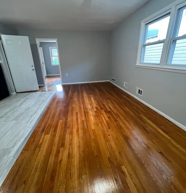 empty room featuring hardwood / wood-style floors