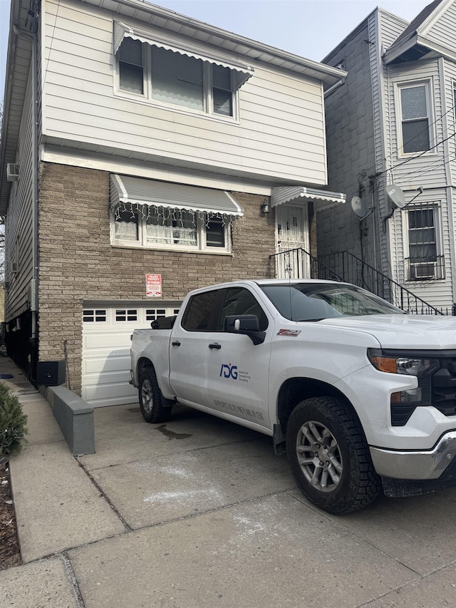 view of front of property featuring a garage