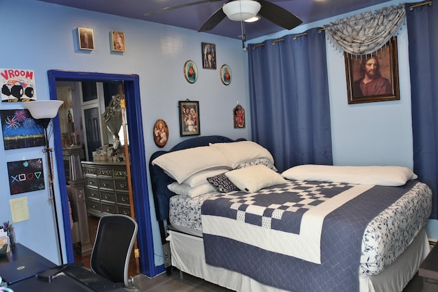 bedroom featuring ceiling fan and wood finished floors