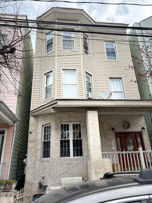 exterior space with stone siding