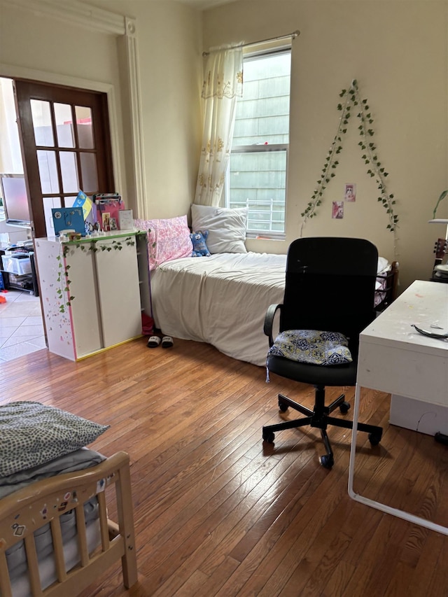 bedroom with wood-type flooring