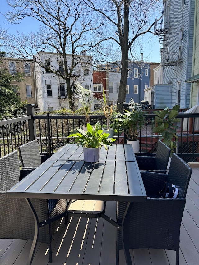 wooden deck featuring outdoor dining area