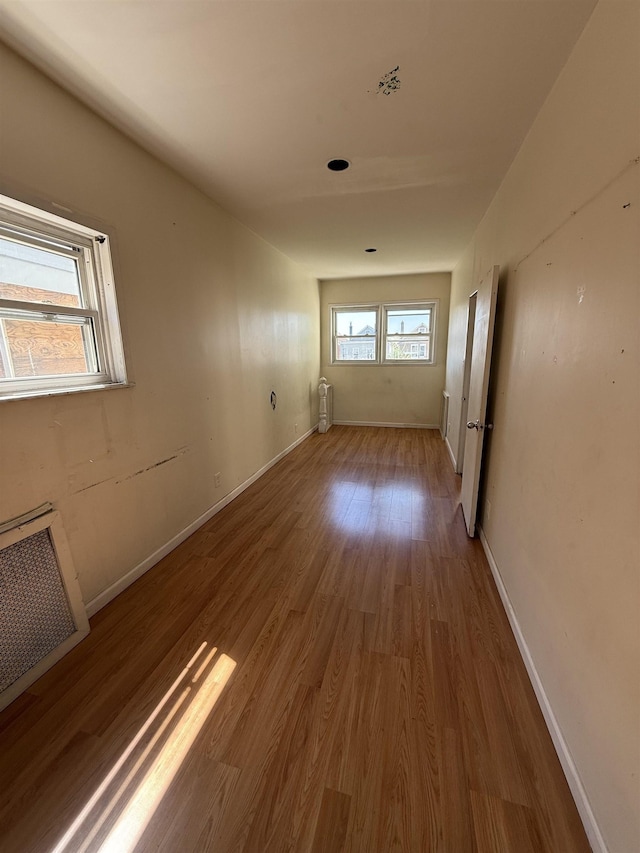 78 W 27th St, Bayonne, NJ 07002 - empty room with wood finished floors and baseboards