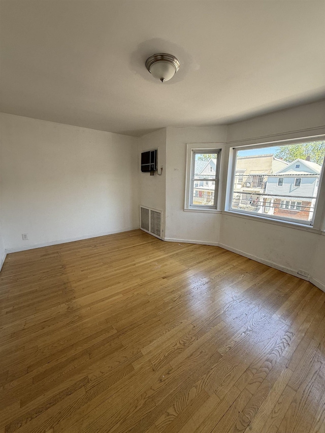 78 W 27th St, Bayonne, NJ 07002 - unfurnished room with wood finished floors and baseboards