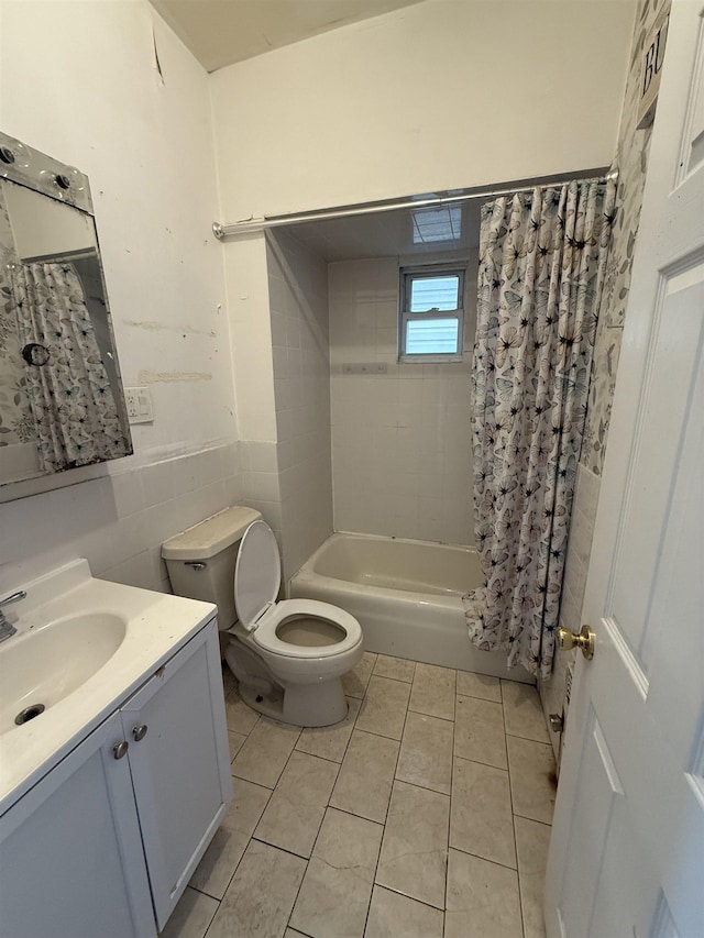78 W 27th St, Bayonne, NJ 07002 - full bathroom with toilet, vanity, tile walls, shower / bath combination with curtain, and tile patterned flooring