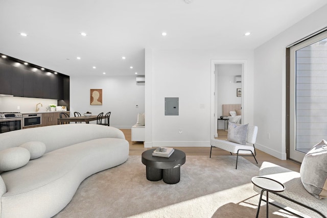 391 1st St Unit 3-B, Jersey City, NJ 07302 - living room featuring recessed lighting, light wood-style flooring, electric panel, and baseboards