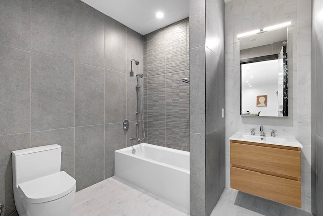 391 1st St Unit 3-B, Jersey City, NJ 07302 - bathroom featuring tile walls, toilet, shower / bath combination, vanity, and marble finish floors