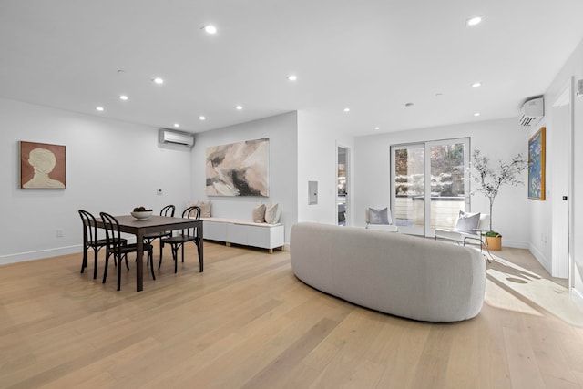 391 1st St Unit 3-B, Jersey City, NJ 07302 - living area featuring a wall mounted AC, recessed lighting, light wood-style floors, and baseboards