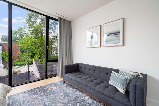 48 Coles St Unit 2, Jersey City, NJ 07302 - sitting room featuring floor to ceiling windows and wood finished floors