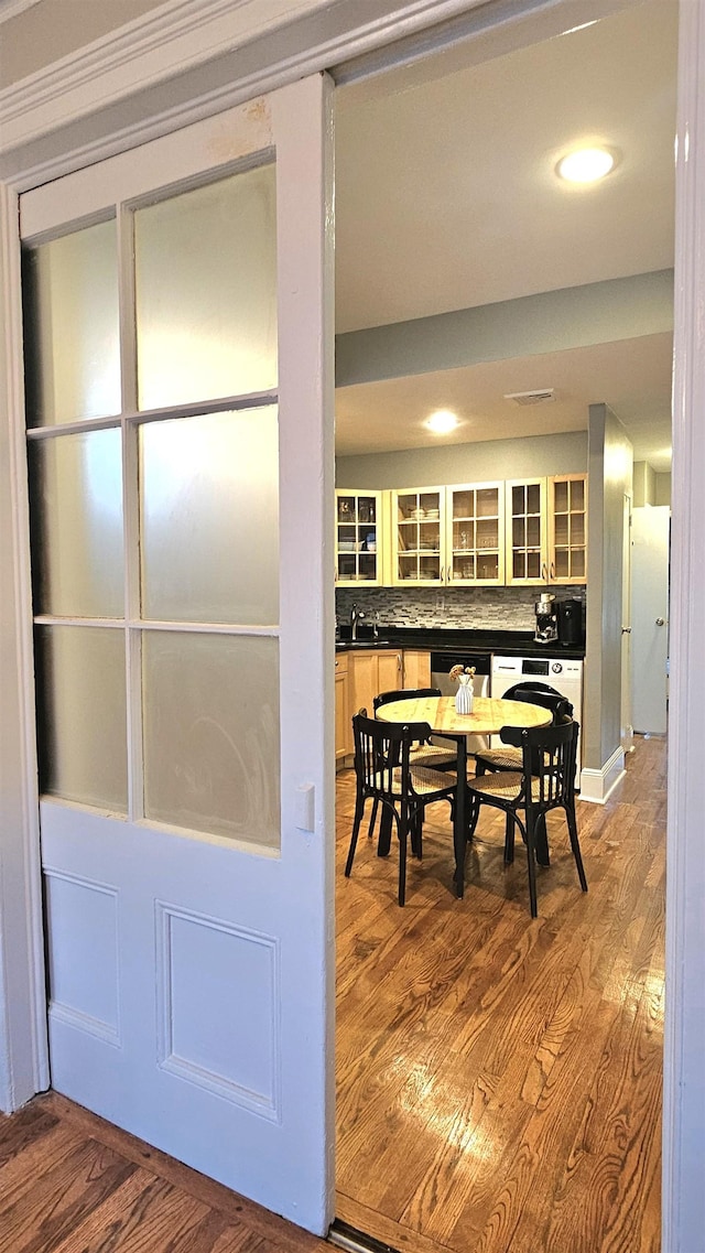 dining area featuring recessed lighting and wood finished floors