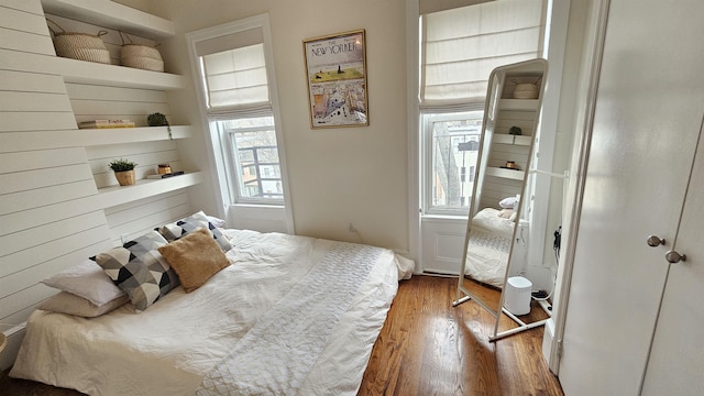 bedroom with wood finished floors