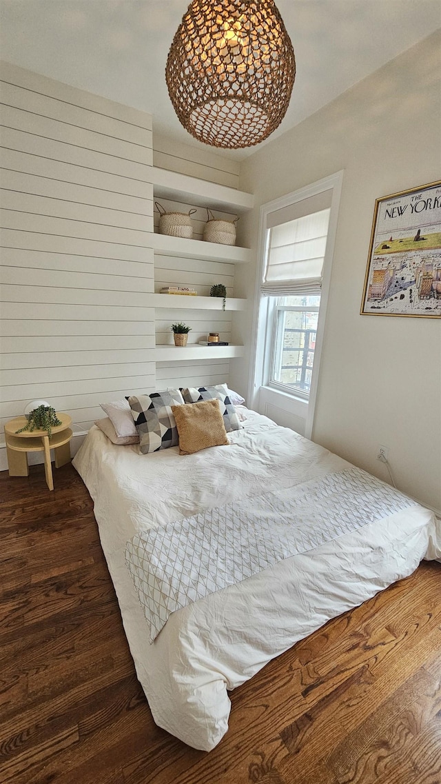 bedroom with wood finished floors