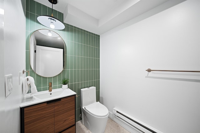 20 Storms Ave Unit 1A, Jersey City, NJ 07306 - bathroom featuring tile walls, vanity, baseboard heating, and toilet