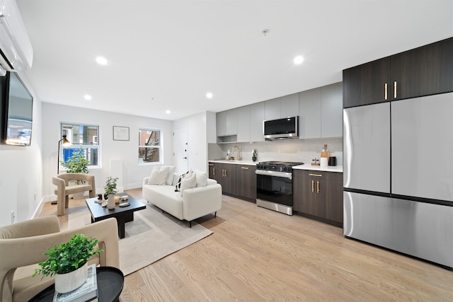 20 Storms Ave Unit 1A, Jersey City, NJ 07306 - living room featuring light wood-style flooring, recessed lighting, and baseboards