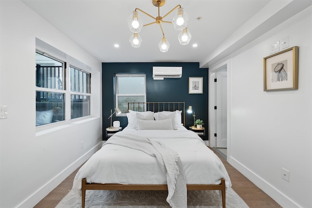 20 Storms Ave Unit 1A, Jersey City, NJ 07306 - bedroom with an AC wall unit, baseboards, wood finished floors, and recessed lighting