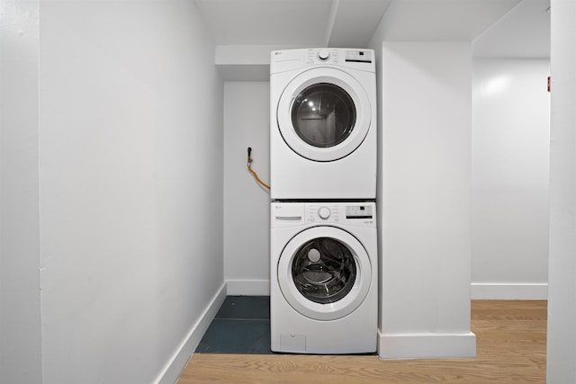 20 Storms Ave Unit 1A, Jersey City, NJ 07306 - washroom featuring estacked washer and dryer and baseboards