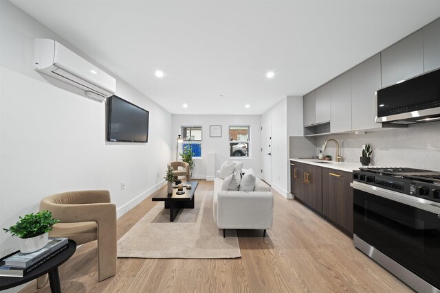 20 Storms Ave Unit 1A, Jersey City, NJ 07306 - living room featuring an AC wall unit, light wood-style flooring, recessed lighting, and baseboards
