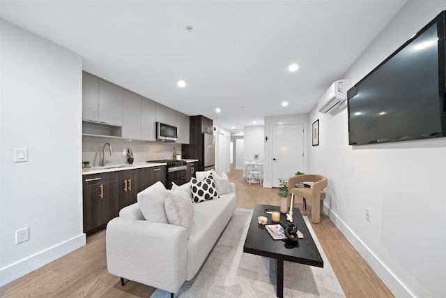20 Storms Ave Unit 1A, Jersey City, NJ 07306 - living room featuring a wall unit AC, light wood finished floors, baseboards, and recessed lighting