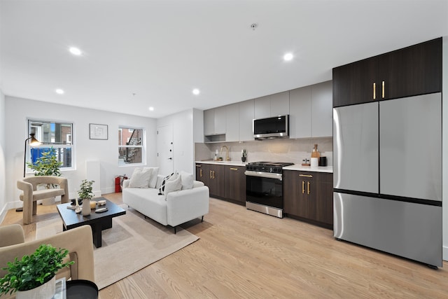 20 Storms Ave Unit 1A, Jersey City, NJ 07306 - living area with light wood finished floors, recessed lighting, and baseboards