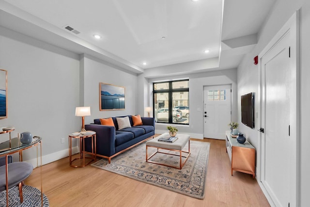 living area featuring wood finished floors, recessed lighting, and baseboards