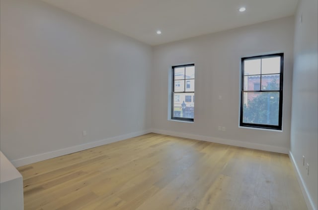 unfurnished room featuring light hardwood / wood-style flooring