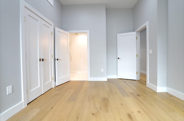 unfurnished bedroom featuring light wood-type flooring