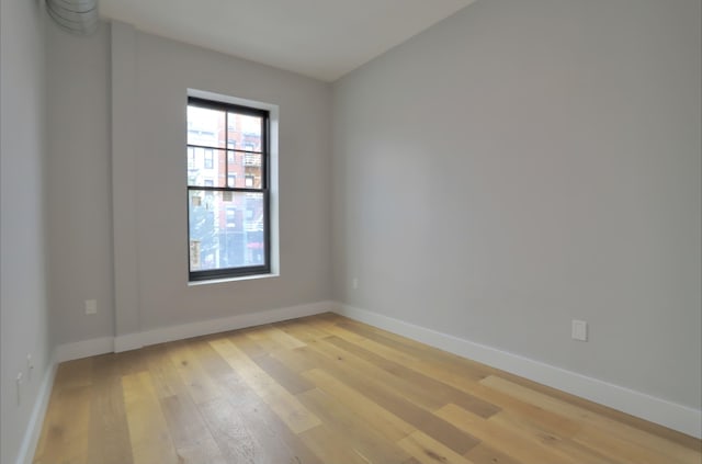 spare room featuring light wood-type flooring