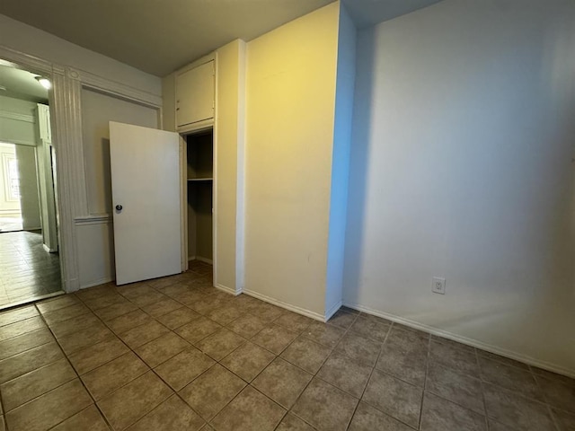 unfurnished bedroom featuring tile patterned floors