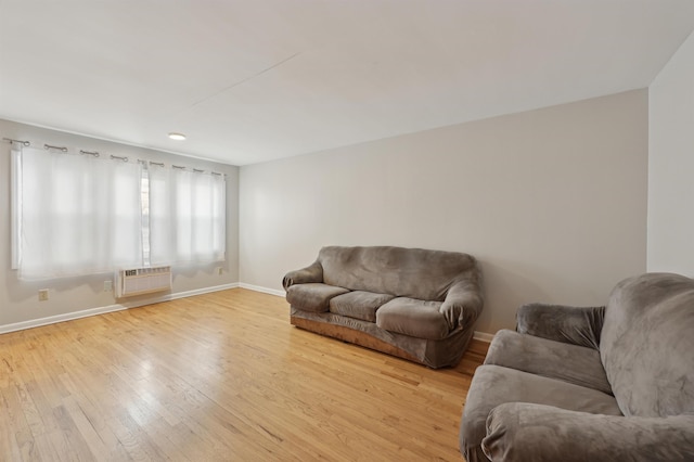 310 70th St Unit 1D, Guttenberg, NJ 07093 - living room featuring baseboards, hardwood / wood-style flooring, and an AC wall unit