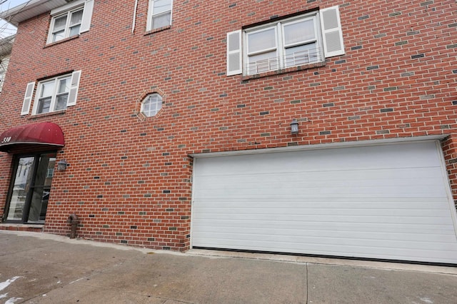 310 70th St Unit 1D, Guttenberg, NJ 07093 - view of building exterior featuring an attached garage