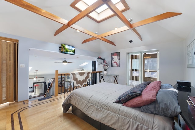 bedroom with light hardwood / wood-style flooring and vaulted ceiling with skylight