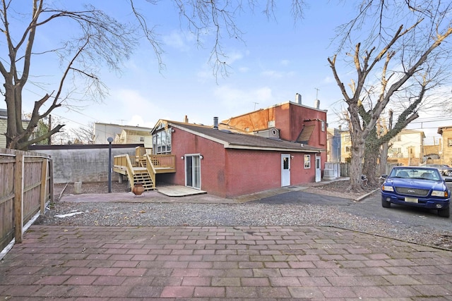 view of side of property with a deck