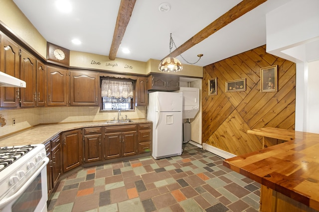 kitchen featuring wood counters, sink, wood walls, beamed ceiling, and white appliances