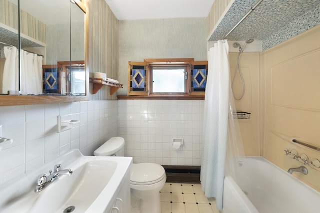 full bathroom featuring shower / tub combo with curtain, toilet, sink, and tile walls