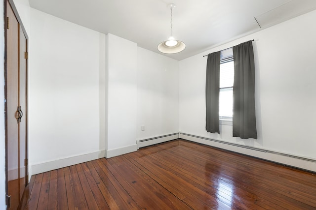 empty room featuring hardwood / wood-style flooring