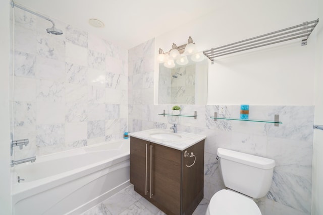 full bathroom with marble finish floor, vanity, toilet, and tile walls