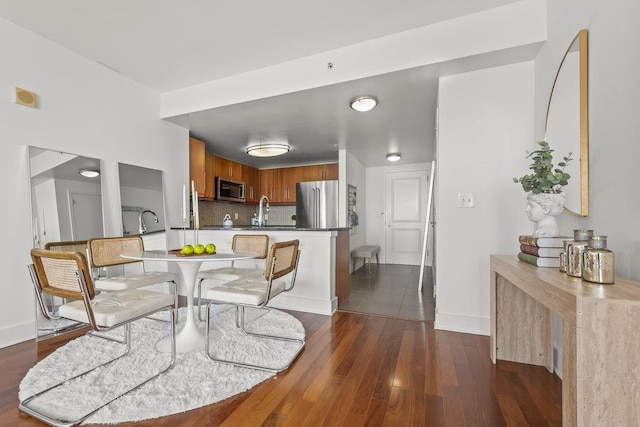 88 Morgan St Unit 4306, Jersey City, NJ 07302 - dining room with dark wood-style flooring and baseboards