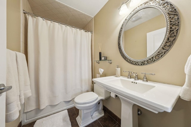 full bathroom featuring toilet, tile patterned flooring, and shower / bathtub combination with curtain