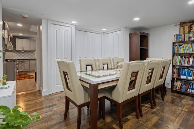 dining room with dark hardwood / wood-style flooring