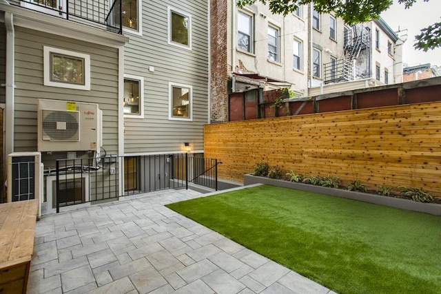 exterior space featuring a patio area and fence