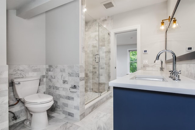 bathroom featuring visible vents, toilet, marble finish floor, a sink, and a shower stall