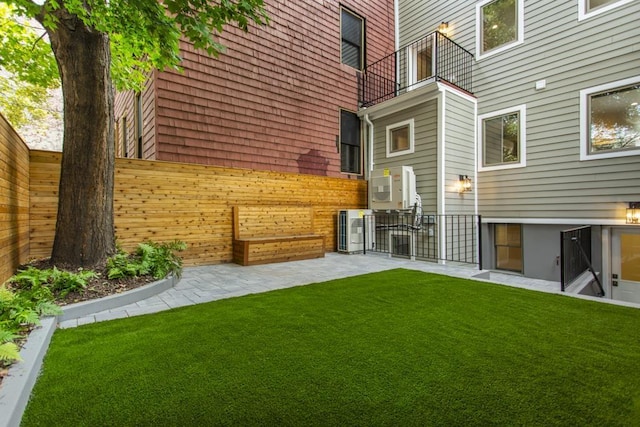 view of yard with a patio and fence