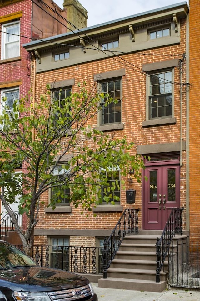 view of front of home with brick siding