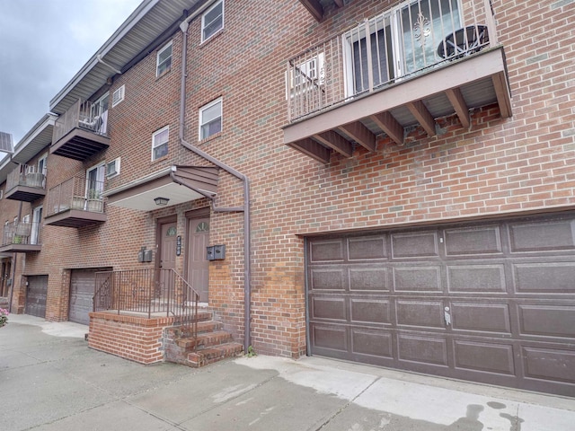2200 Paterson Plank Rd Unit 19, North Bergen, NJ 07047 - view of property with an attached garage and driveway