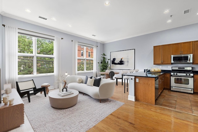 187 Warren St Unit 202, Jersey City, NJ 07302 - living room with crown molding, recessed lighting, and light wood-style floors