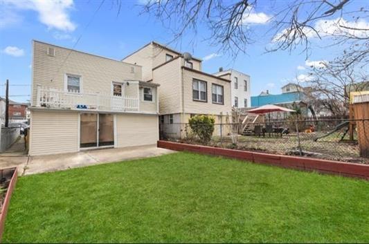 4319 Cottage Ave, North Bergen, NJ 07047 - back of house featuring a fenced backyard and a patio
