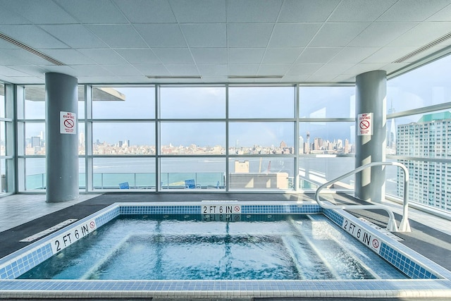 view of pool with a view of city