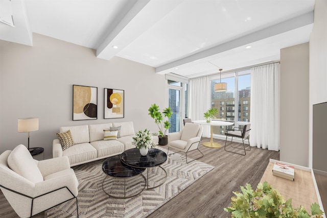 living area with a view of city, beamed ceiling, recessed lighting, and wood finished floors