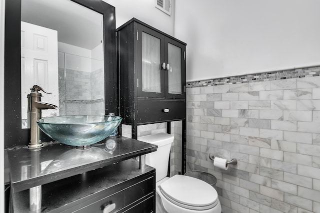 294 Barrow St Unit 6, Jersey City, NJ 07302 - bathroom featuring tile walls and vanity
