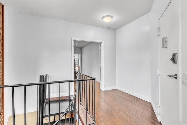 294 Barrow St Unit 6, Jersey City, NJ 07302 - corridor with an upstairs landing and wood finished floors